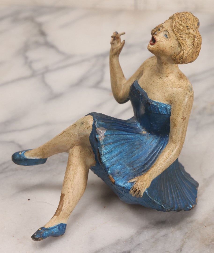 Lot 024 - Vintage Painted Cast White Metal Art Deco Incense Burner Depicting A Blonde Woman In Blue Dress Holding A Cigarette