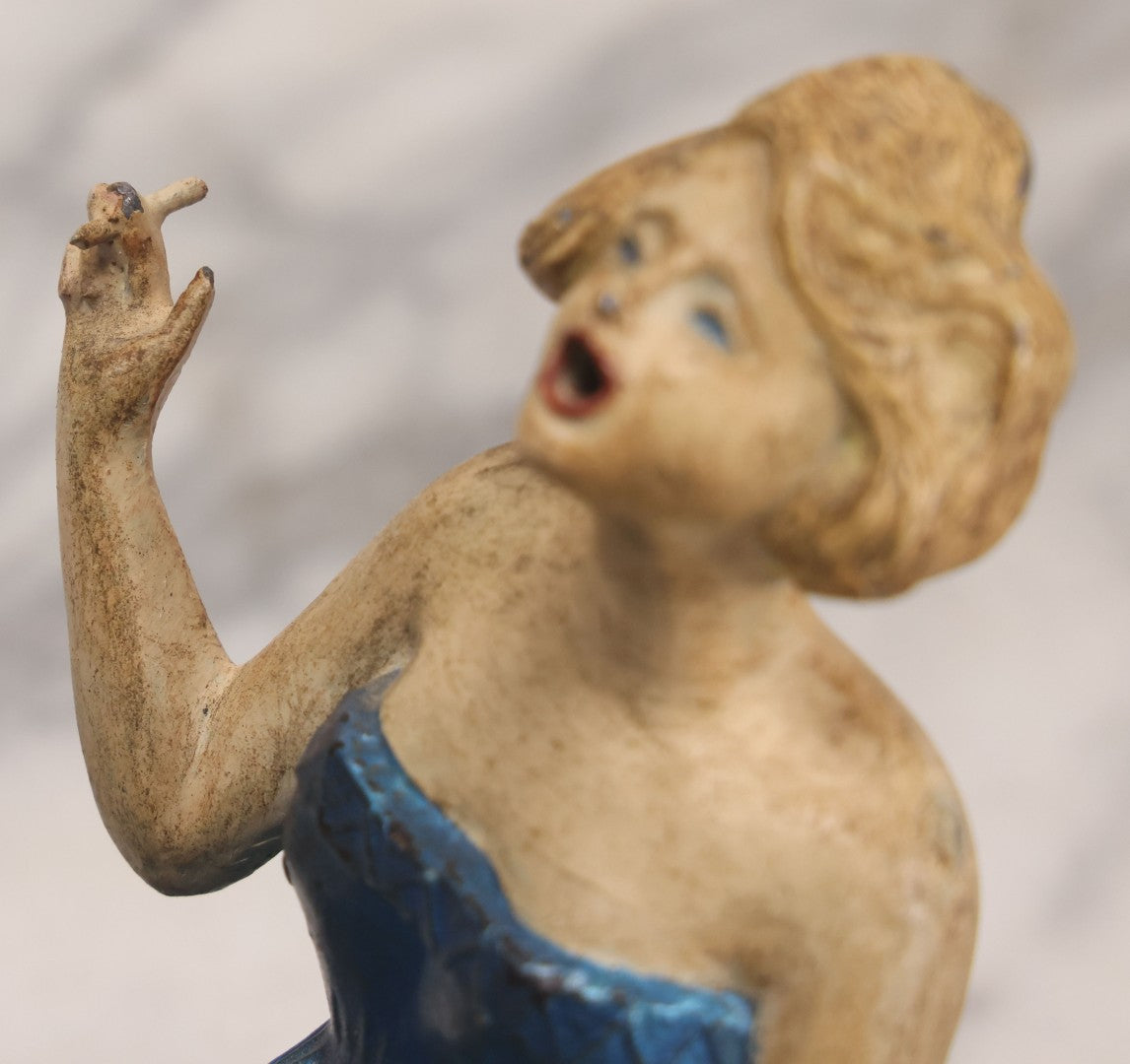 Lot 024 - Vintage Painted Cast White Metal Art Deco Incense Burner Depicting A Blonde Woman In Blue Dress Holding A Cigarette