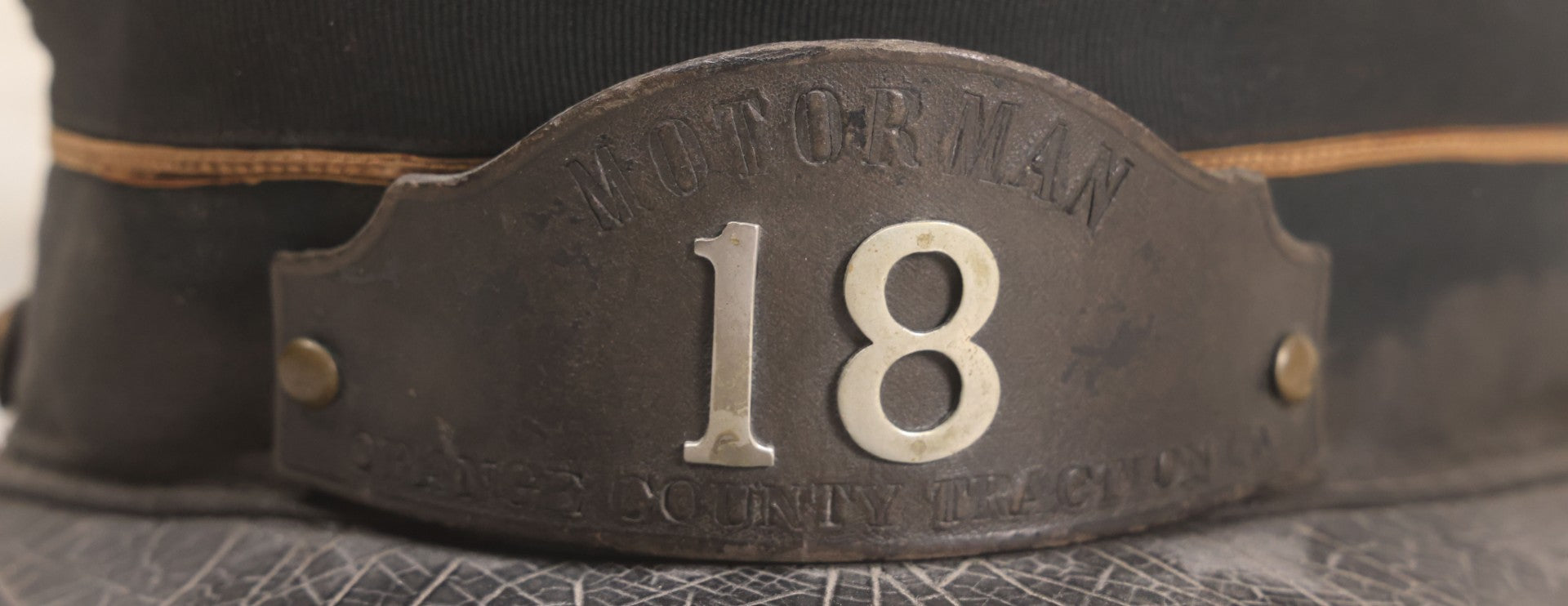 Lot 027 - Antique Orange County Traction Company Trolley Railroad Motorman Hat Number 18 With Leather Badge, Metal Numbers, And Brass Eagle Buttons, Newburgh, New York, Circa Early 20th Century