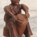 Lot 029 - Vintage Folk Art Carved Wood Figure With Posable Arms Depicting A Seated Man With Drum, 6-1/4" H