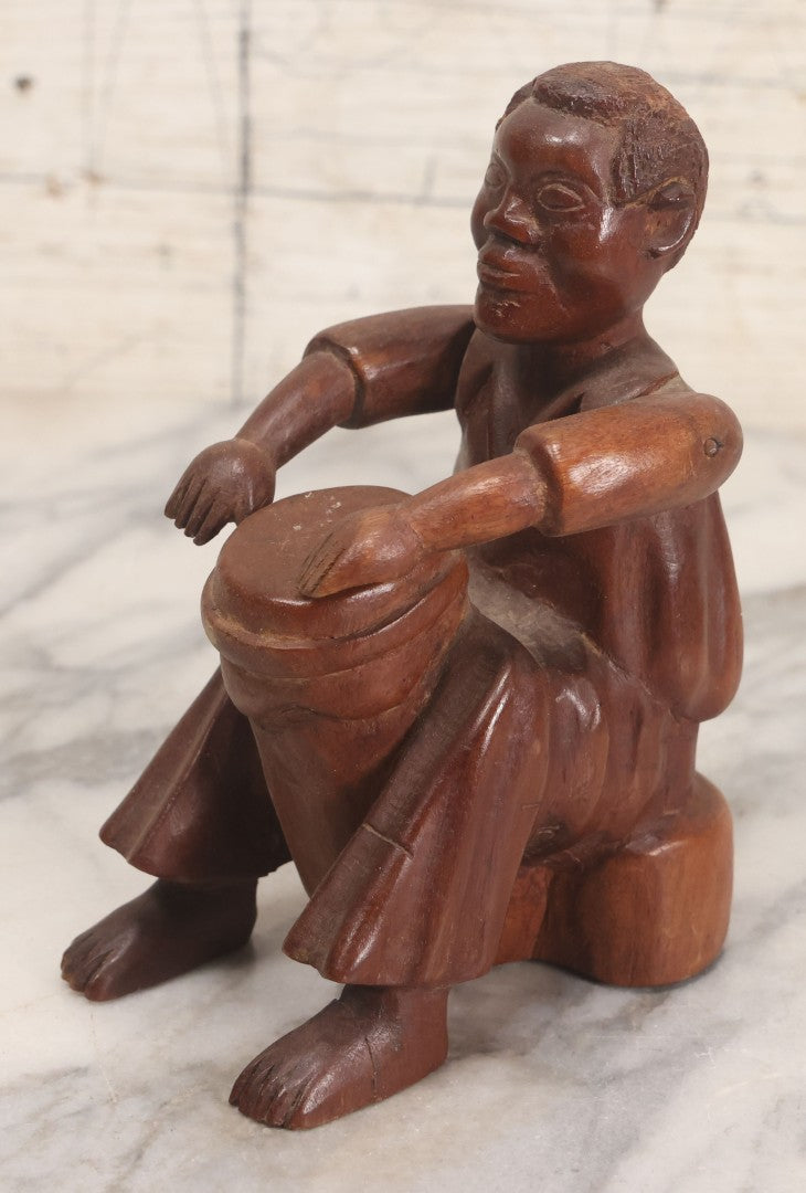 Lot 029 - Vintage Folk Art Carved Wood Figure With Posable Arms Depicting A Seated Man With Drum, 6-1/4" H