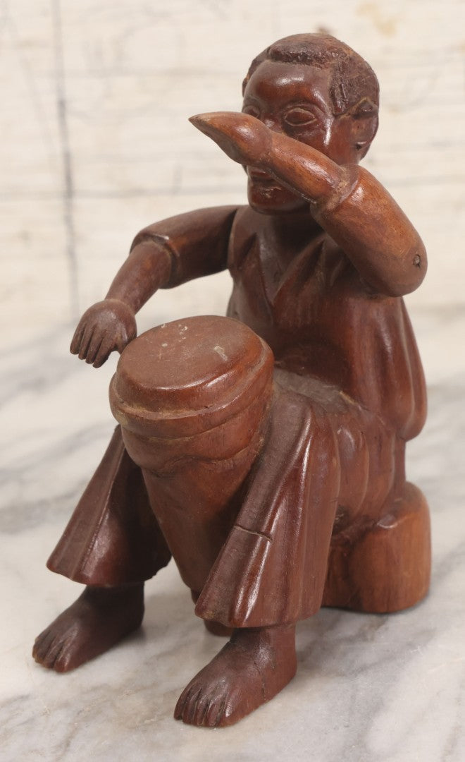 Lot 029 - Vintage Folk Art Carved Wood Figure With Posable Arms Depicting A Seated Man With Drum, 6-1/4" H