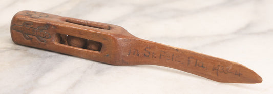 Lot 030 - Vintage Carved Folk Art Letter Opener With Captive Balls "In St. Pete, Fla 1933-4" And "With Old Nick," Pyrography Decoration Including Iron Cross, Pelican, Alligator, And Clover, 6-3/8" L