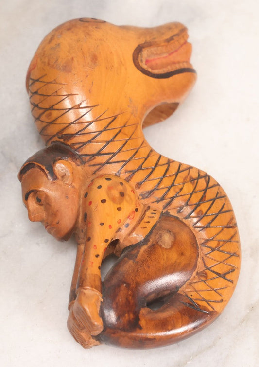 Lot 031 - Vintage Folk Art Carved Wood Cane Topper Depicting A Frightened Man Riding A Serpent, 4" H