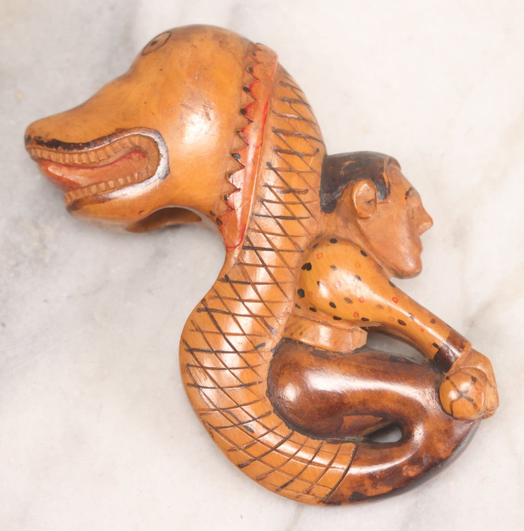 Lot 031 - Vintage Folk Art Carved Wood Cane Topper Depicting A Frightened Man Riding A Serpent, 4" H