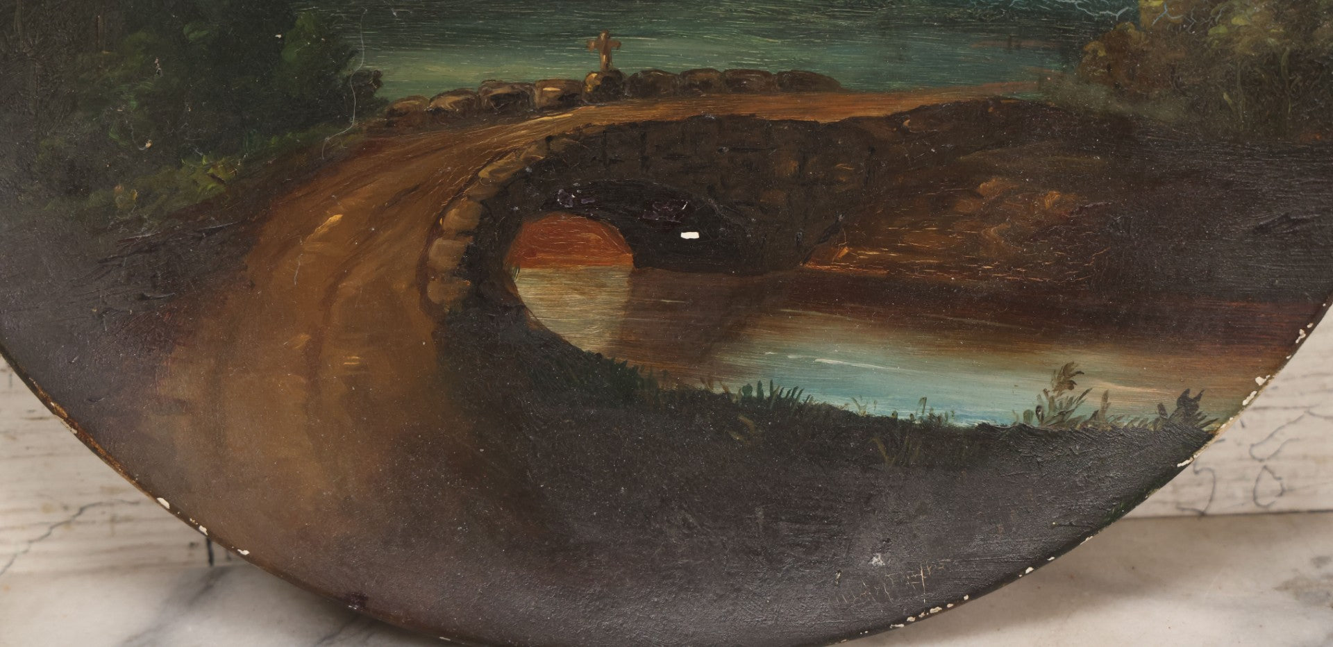 Lot 044 - Antique Folk Art Hand Painted Papier Mache Charger With Stone Bridge, Mountain Lake Landscape, And Cloudy Sky, Circa 1880, 12-1/8" Diameter