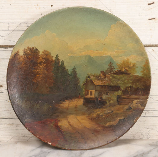 Lot 045 - Antique Folk Art Hand Painted Papier Mache Charger With Rustic Cottage, Mountain Landscape, And Autumn Trees, Circa 1880, 12" Diameter