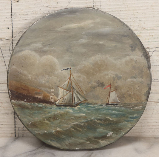 Lot 047 - Antique Hand-Painted Maritime Seascape On Tin Lid With Sailboats And Lighthouse, Unsigned, 6-1/4" Diameter