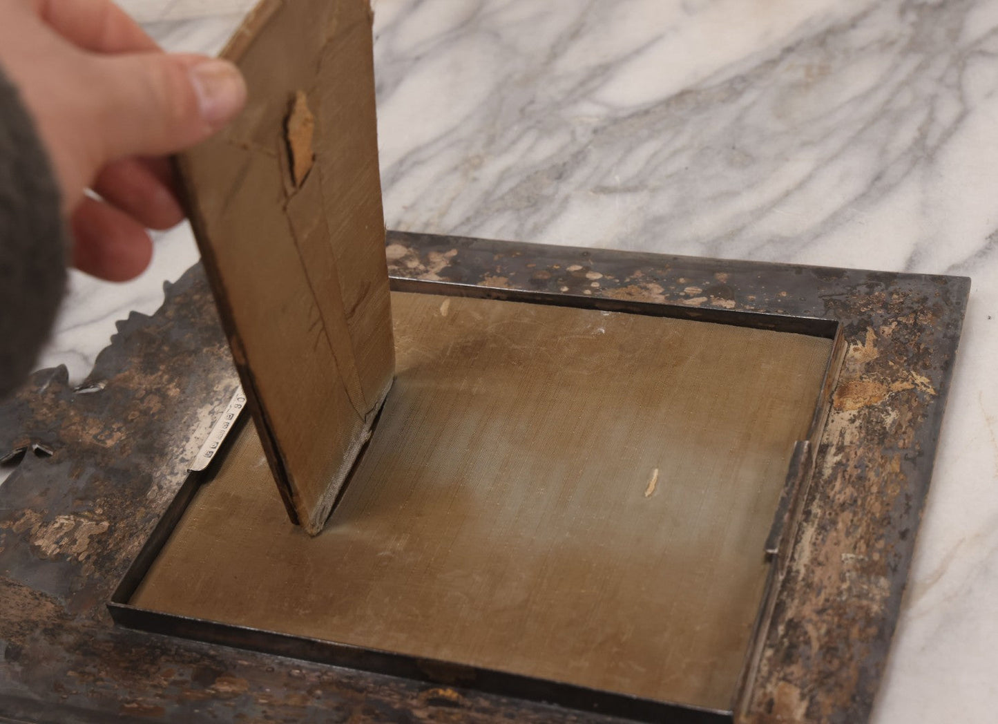 Lot 053 - Antique French Silvered Bronze Picture Frame With Crowned Crest And Fleur-De-Lis, Easel Back, No Glass, Circa Late 19th / Early 20th Century, 10-1/8" x 14-3/4"