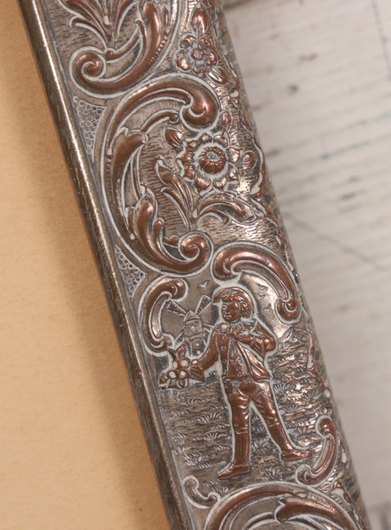 Lot 054 - Antique French Silvered Bronze Picture Frame With Repoussé Floral Scrollwork And Figural Scenes, With Glass, Circa Early 20th Century, 10-3/4" x 13-1/2"