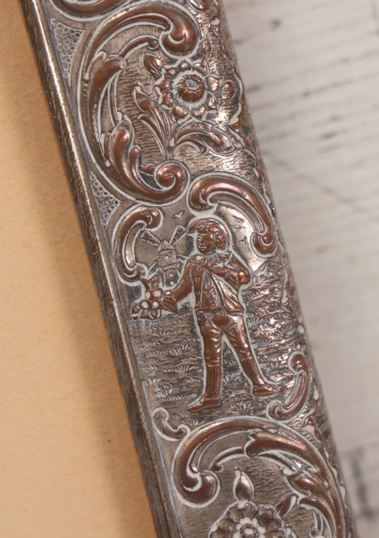 Lot 054 - Antique French Silvered Bronze Picture Frame With Repoussé Floral Scrollwork And Figural Scenes, With Glass, Circa Early 20th Century, 10-3/4" x 13-1/2"