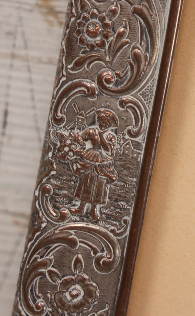 Lot 054 - Antique French Silvered Bronze Picture Frame With Repoussé Floral Scrollwork And Figural Scenes, With Glass, Circa Early 20th Century, 10-3/4" x 13-1/2"