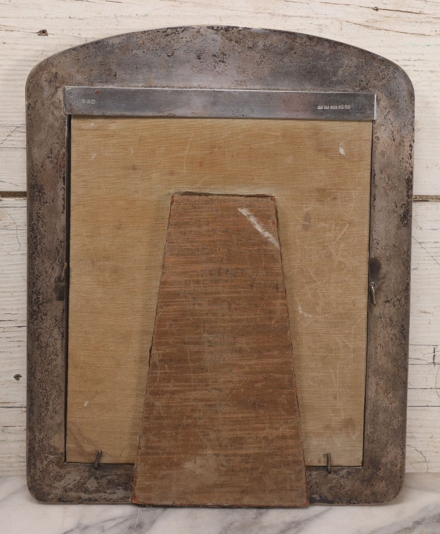 Lot 054 - Antique French Silvered Bronze Picture Frame With Repoussé Floral Scrollwork And Figural Scenes, With Glass, Circa Early 20th Century, 10-3/4" x 13-1/2"