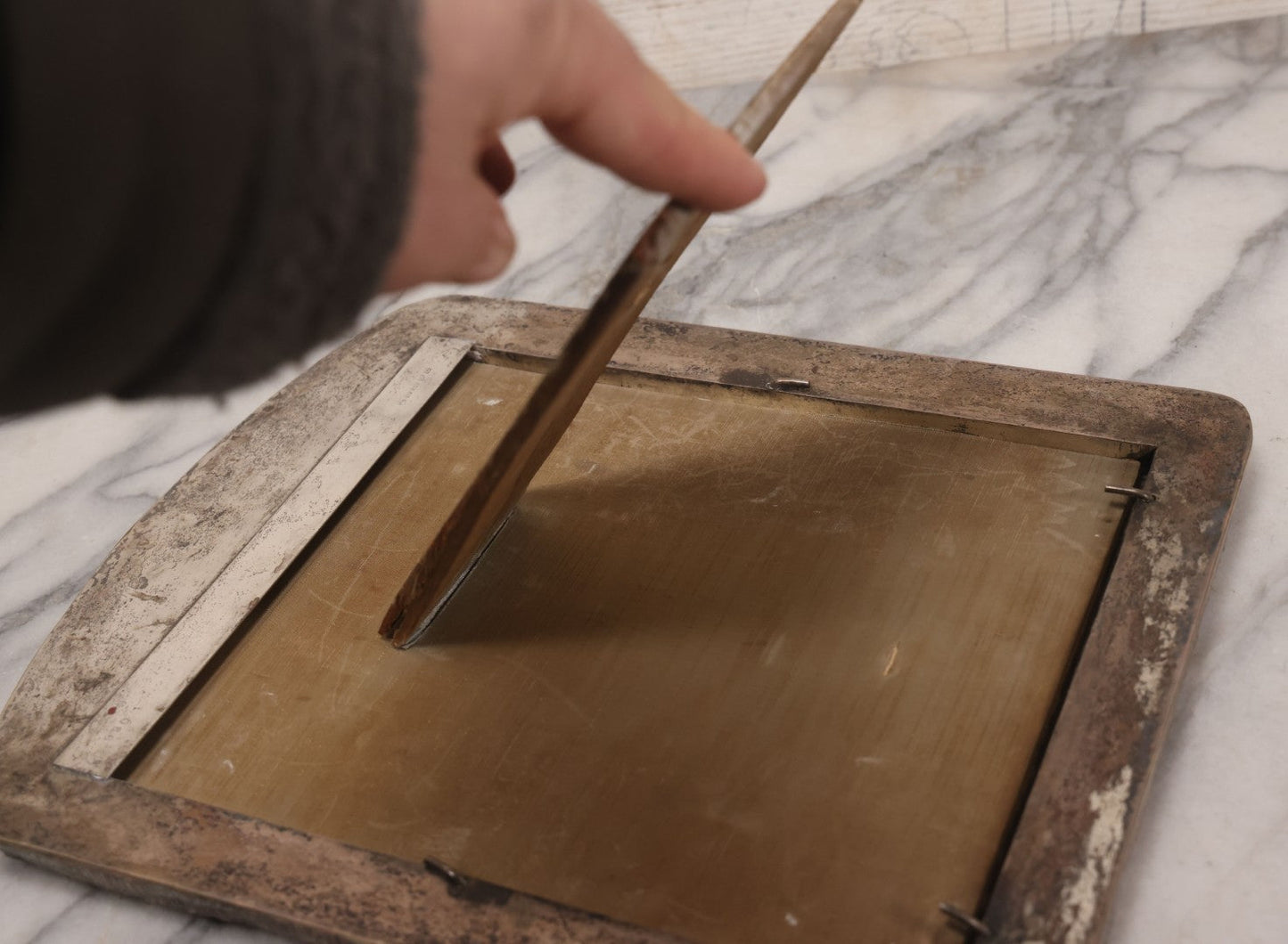 Lot 054 - Antique French Silvered Bronze Picture Frame With Repoussé Floral Scrollwork And Figural Scenes, With Glass, Circa Early 20th Century, 10-3/4" x 13-1/2"