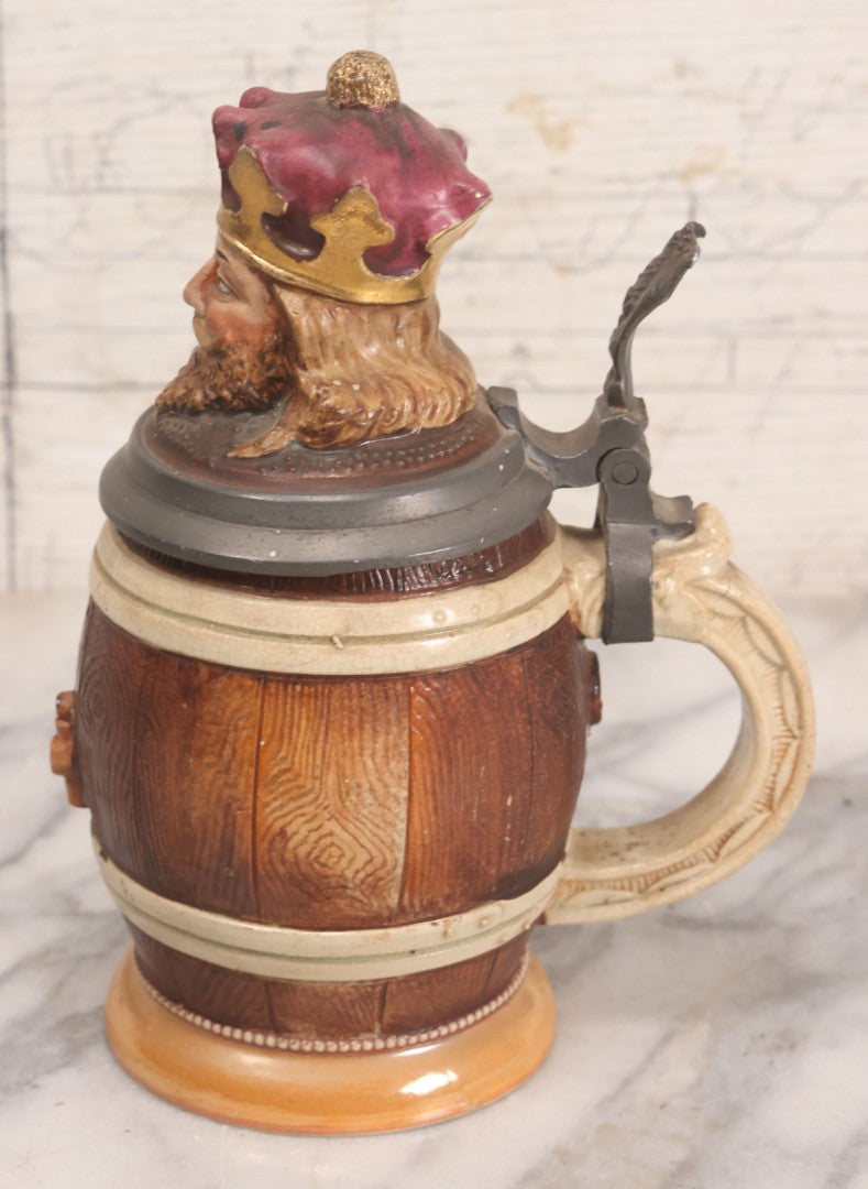 Lot 056 - Antique German Beer Stein With King Figural Lid, Hinged Pewter Top, Marked D.R.G.M. 154927 And Germany, Adolf Diesinger No. 705, Circa 1900, 7-3/4" H