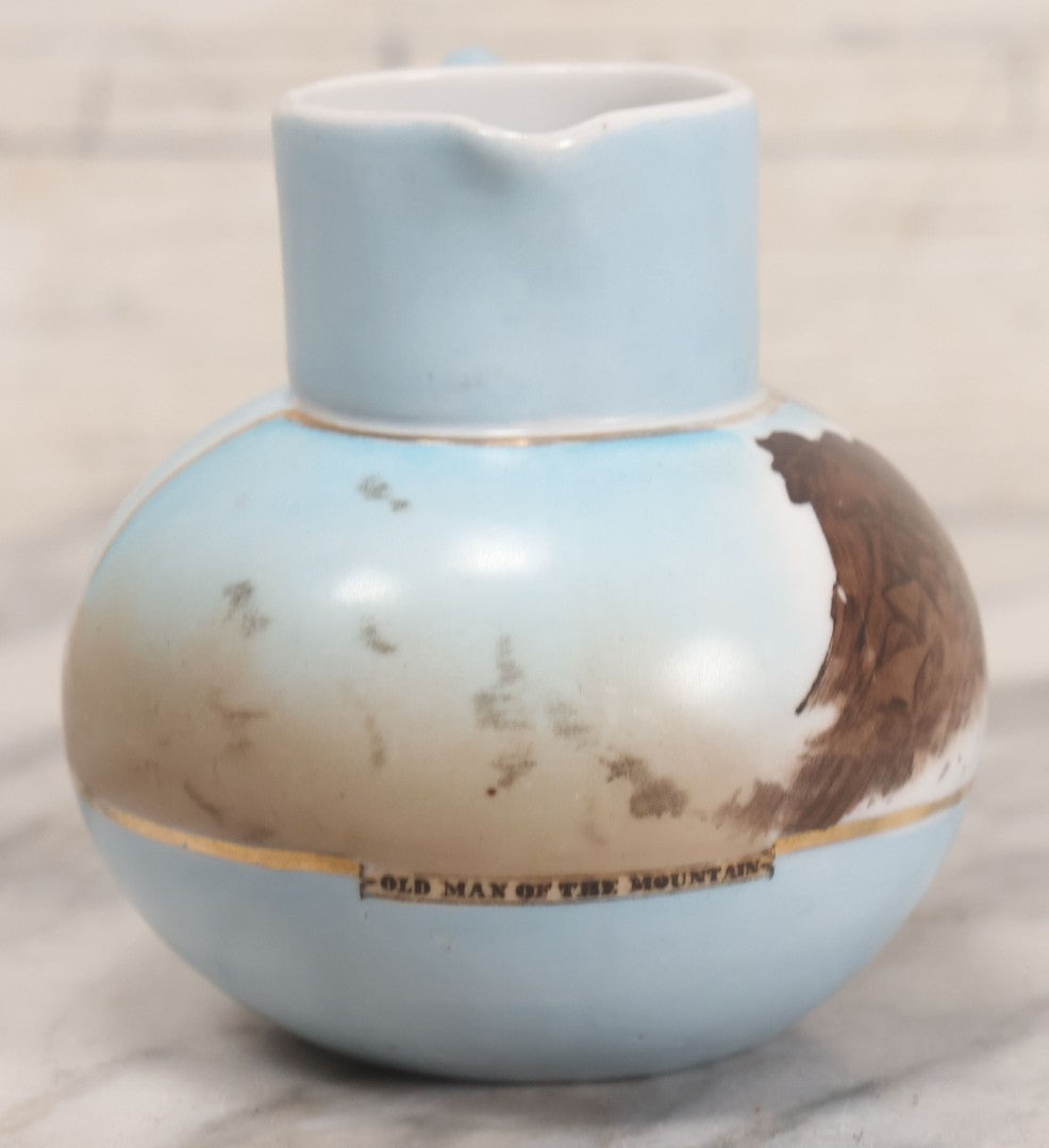 Lot 057 - Vintage Hand Painted German China Creamer Pitcher With Old Man Of The Mountain, White Mountains New Hampshire Souvenir Scene, 3-3/4" H