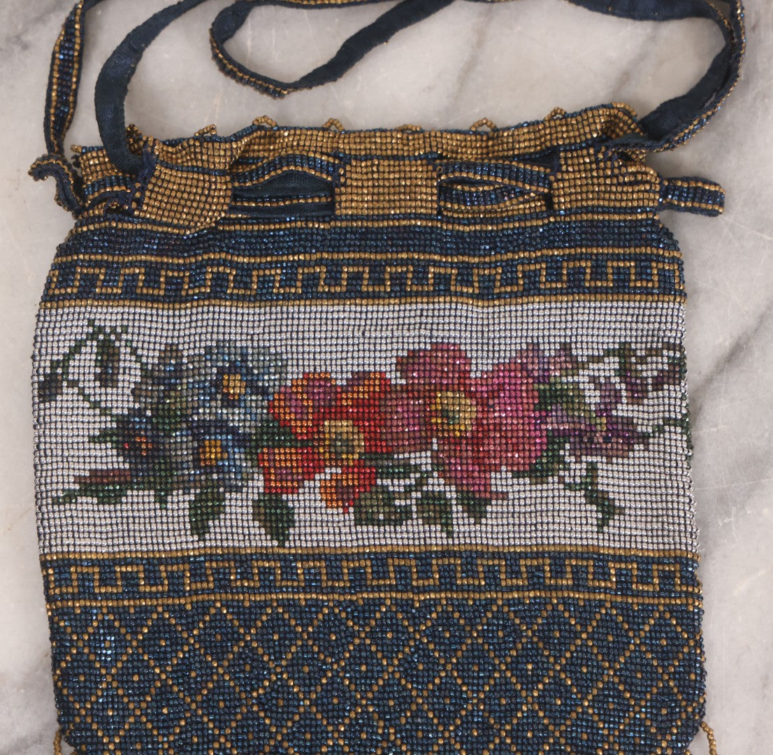 Lot 061 - Antique Beaded Drawstring Purse With Floral Panel, Greek Key Border, And Beaded Fringe, Seed Bead Construction