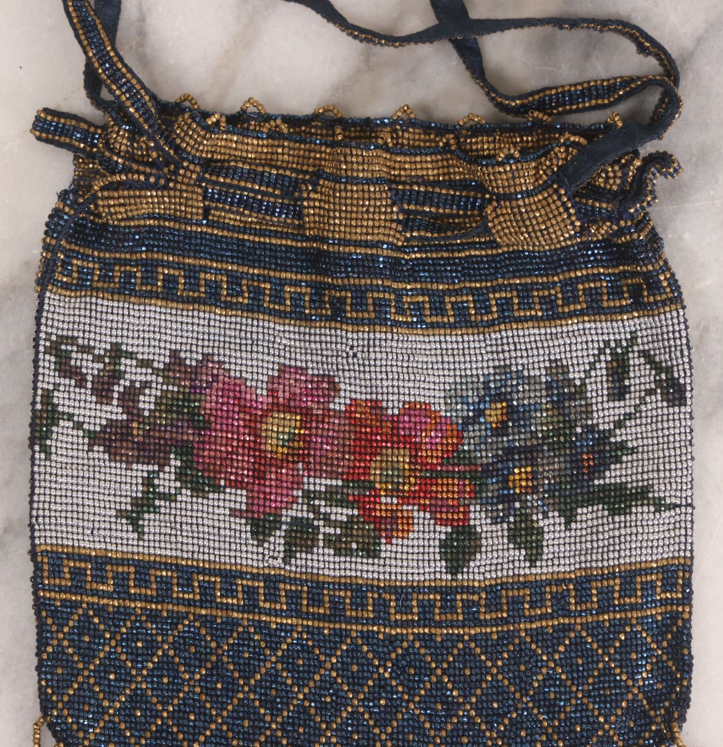 Lot 061 - Antique Beaded Drawstring Purse With Floral Panel, Greek Key Border, And Beaded Fringe, Seed Bead Construction