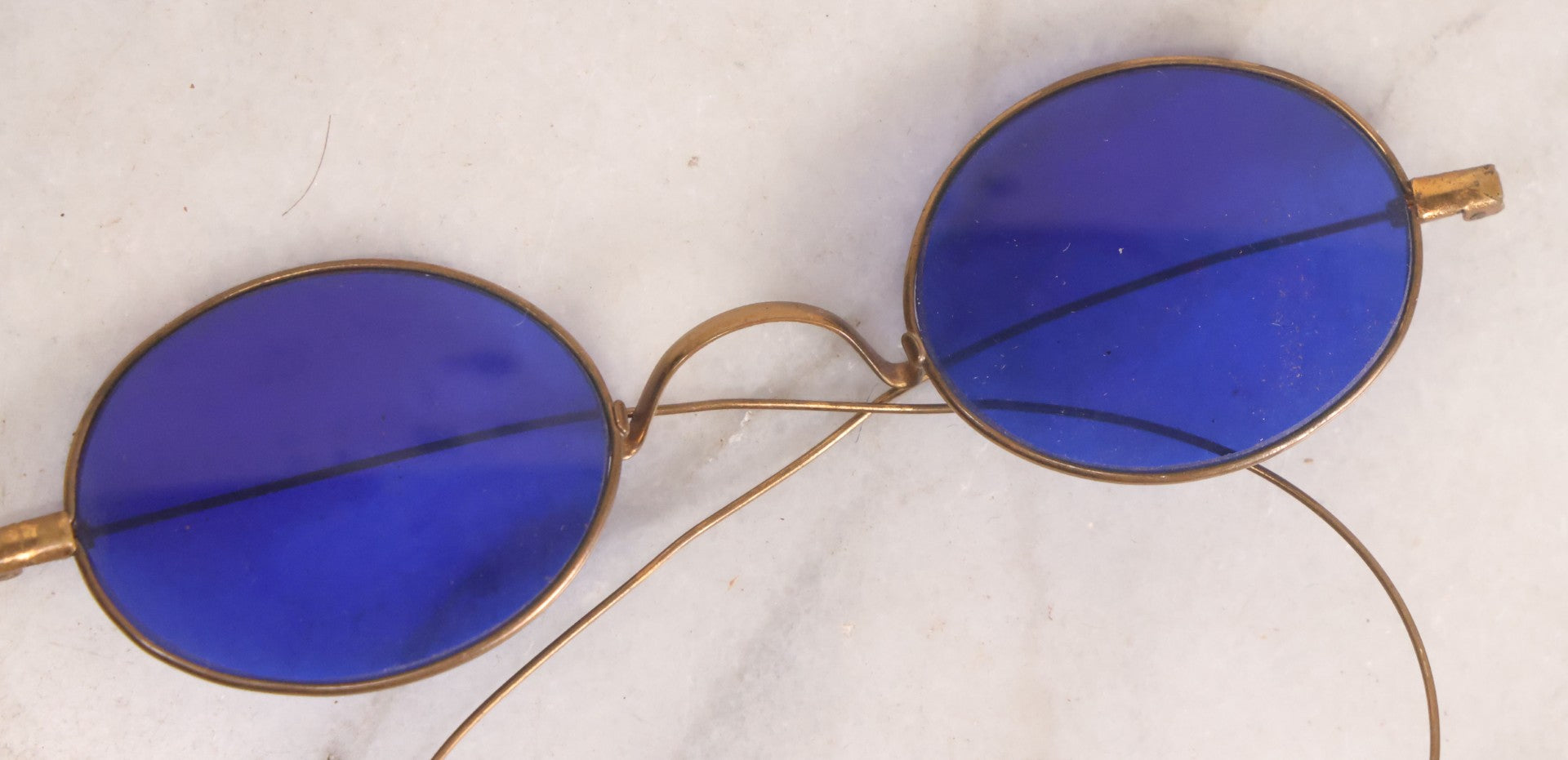 Lot 063 - Grouping Of Four Antique Wire Frame Spectacles Including Blue Lens Spectacles, With Two Partial Leather Cases, Edward E. Dammers, Worcester, Massachusetts