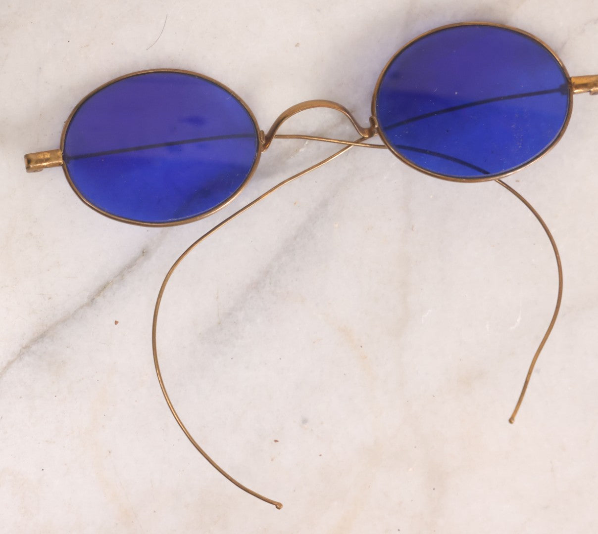 Lot 063 - Grouping Of Four Antique Wire Frame Spectacles Including Blue Lens Spectacles, With Two Partial Leather Cases, Edward E. Dammers, Worcester, Massachusetts