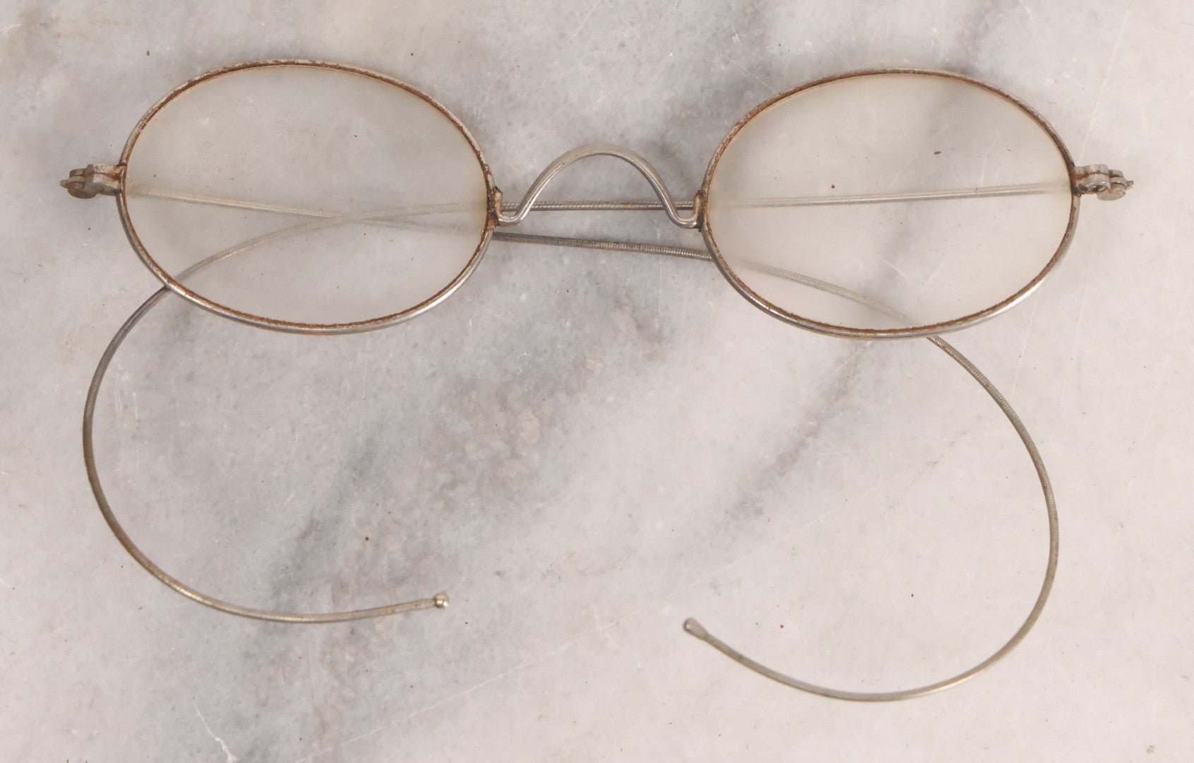Lot 063 - Grouping Of Four Antique Wire Frame Spectacles Including Blue Lens Spectacles, With Two Partial Leather Cases, Edward E. Dammers, Worcester, Massachusetts