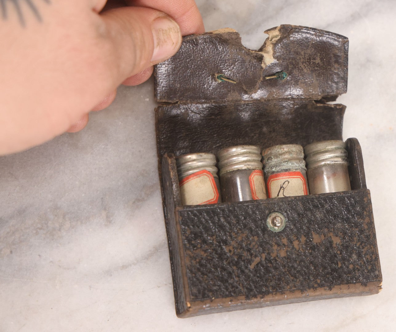 Lot 067 - Antique Pocket Apothecary / Homeopathic Vial Set With Four Glass Vials In Leatherette Case, Metal Screw Caps, Handwritten Labels
