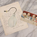 Lot 068 - Pair Of Antique Nursing Bottle Ephemera Pieces Depicting Early Nursing Bottles, So-Called “Murder Bottles,” 1902 Valentine By Walter Wirths And 1887 N.Y. Condensed Milk Co. Trade Card