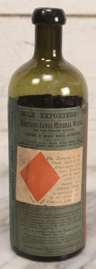 Lot 069 - Antique Hunyadi János Budai Mineral Spring Water Bottle With Paper Label, The Apollinaris Company, Andreas Saxlehner, Budapest, Hungary, 9-1/4" H
