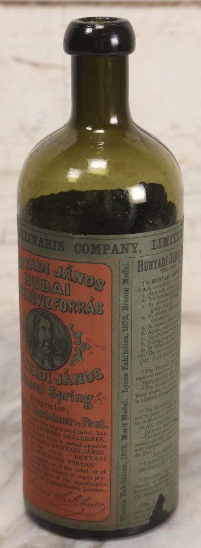 Lot 069 - Antique Hunyadi János Budai Mineral Spring Water Bottle With Paper Label, The Apollinaris Company, Andreas Saxlehner, Budapest, Hungary, 9-1/4" H