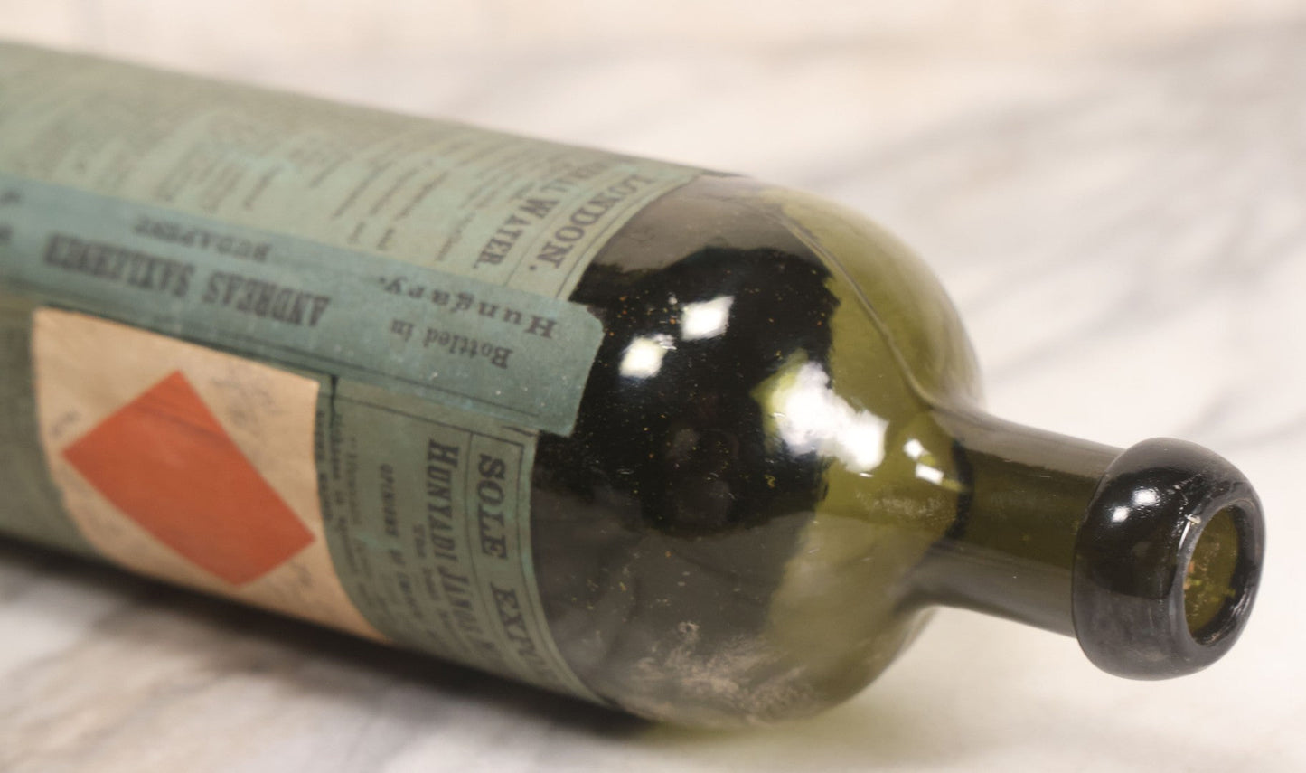 Lot 069 - Antique Hunyadi János Budai Mineral Spring Water Bottle With Paper Label, The Apollinaris Company, Andreas Saxlehner, Budapest, Hungary, 9-1/4" H