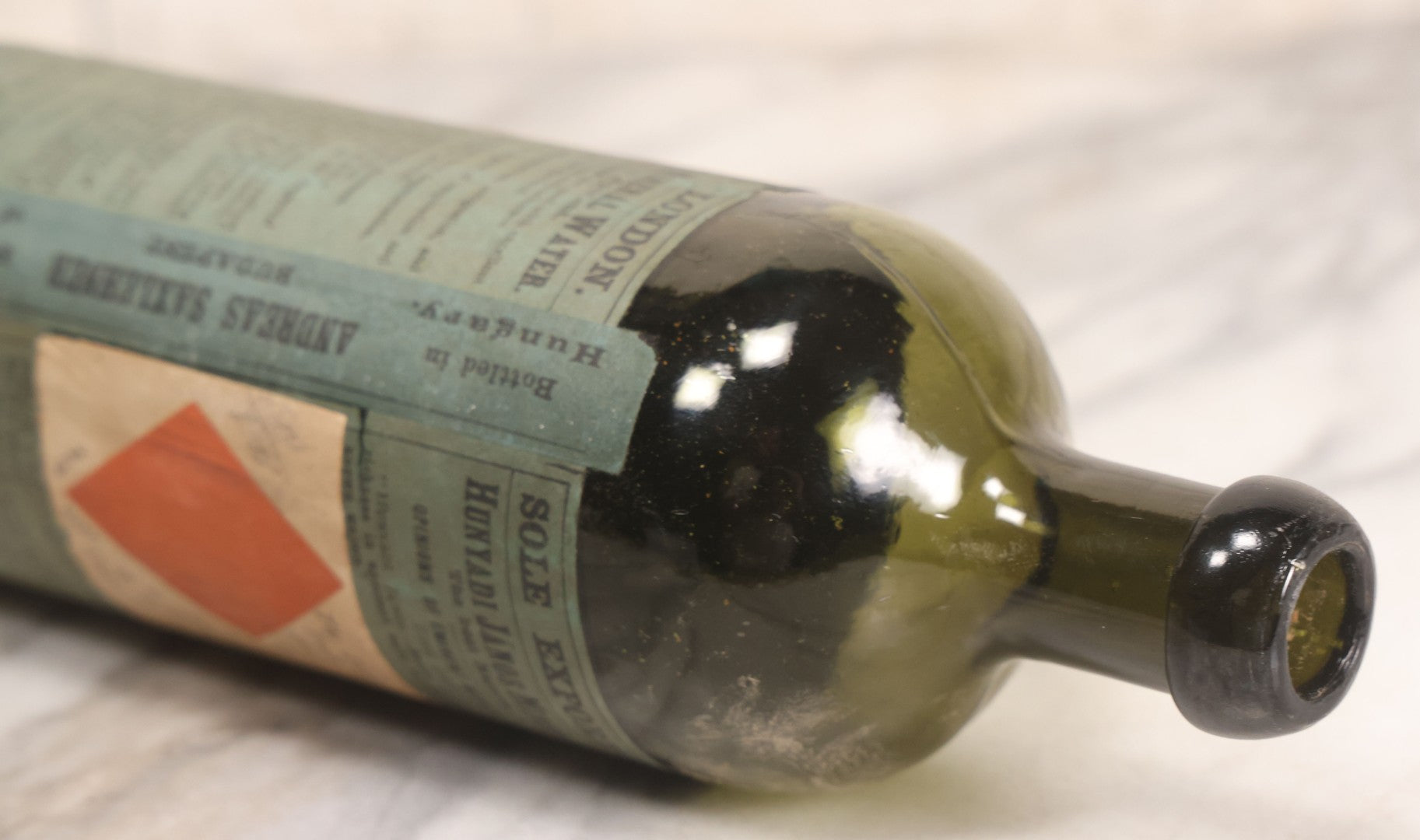 Lot 069 - Antique Hunyadi János Budai Mineral Spring Water Bottle With Paper Label, The Apollinaris Company, Andreas Saxlehner, Budapest, Hungary, 9-1/4" H