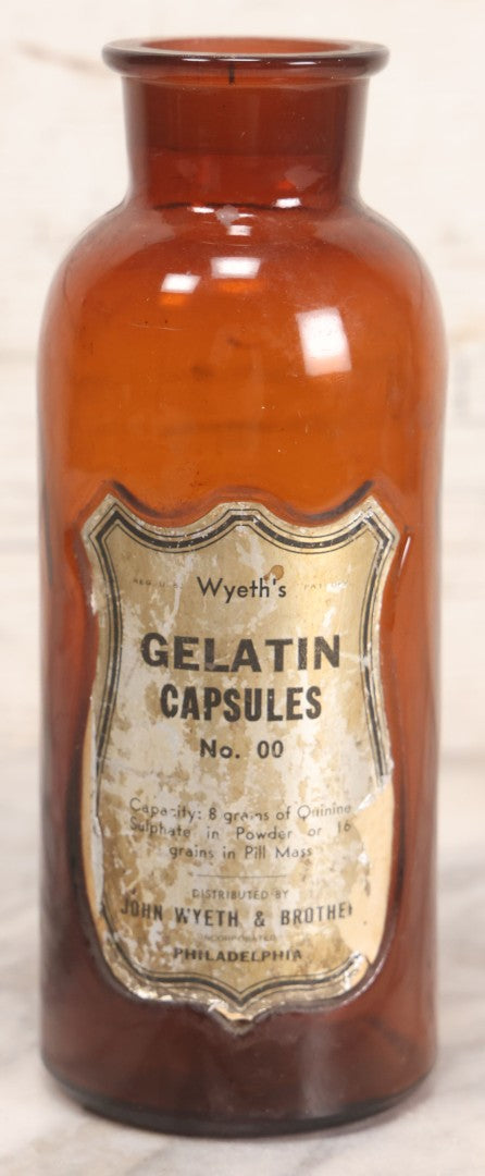 Lot 070 - Antique Wyeth's Gelatin Capsules No. 00 Amber Glass Pharmacy Bottle, John Wyeth & Brother, Philadelphia, 7-3/4" H