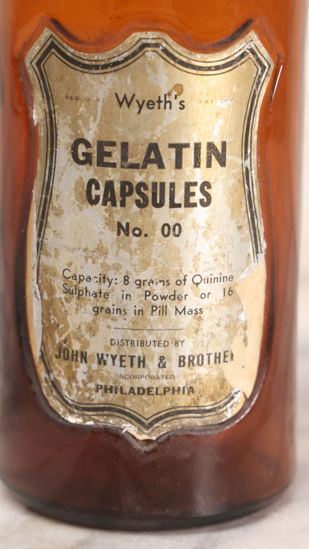 Lot 070 - Antique Wyeth's Gelatin Capsules No. 00 Amber Glass Pharmacy Bottle, John Wyeth & Brother, Philadelphia, 7-3/4" H