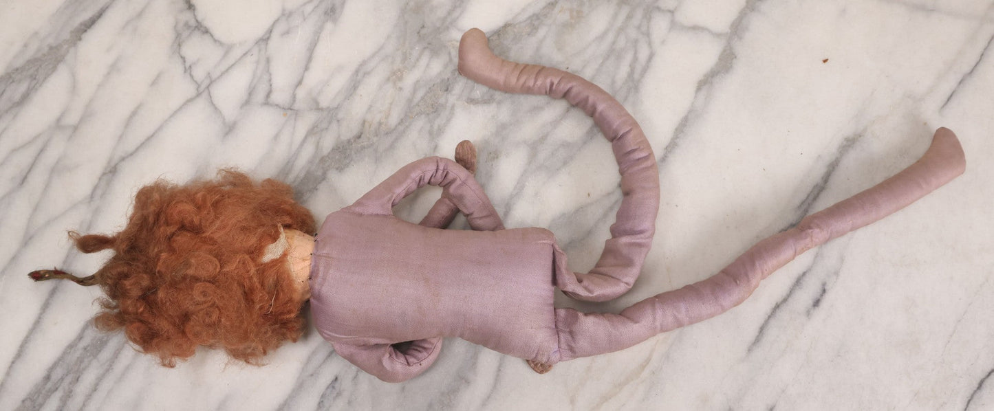 Lot 082 - Antique Boudoir Doll With Painted Features, Mohair Wig, And Floppy Lavender-Pink Body, 27" L