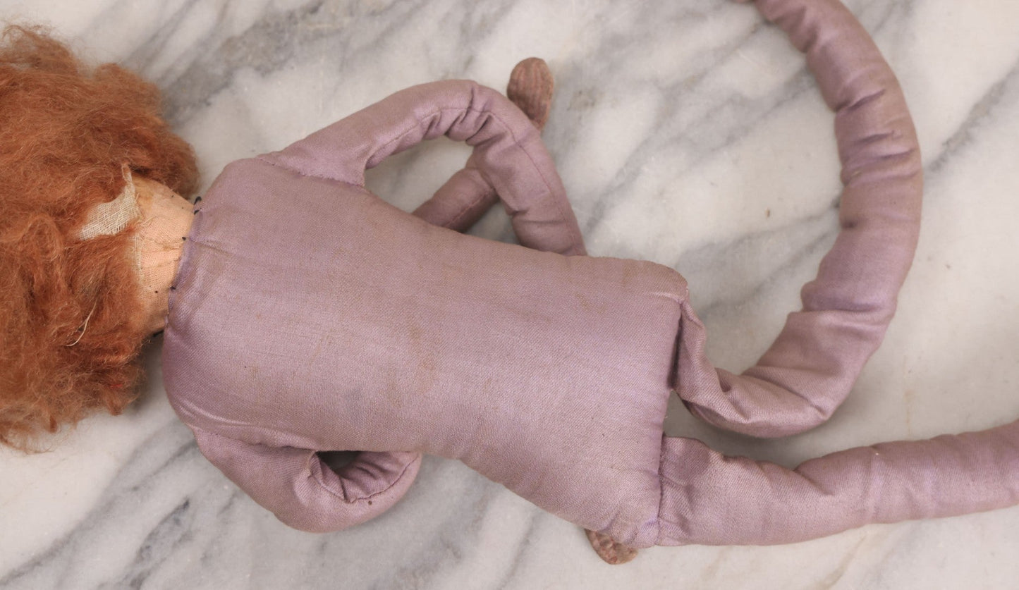 Lot 082 - Antique Boudoir Doll With Painted Features, Mohair Wig, And Floppy Lavender-Pink Body, 27" L