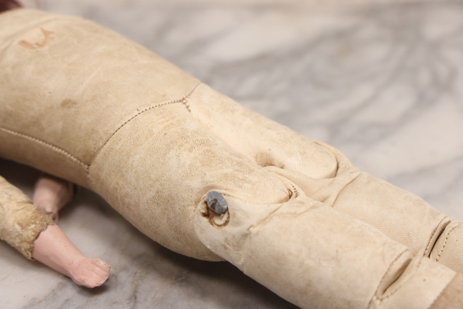 Lot 083 - Antique German Metal Head Doll With Blue Glass Eyes, Leather And Cloth Body And Limbs, Circa 1880s-1910s 17" H