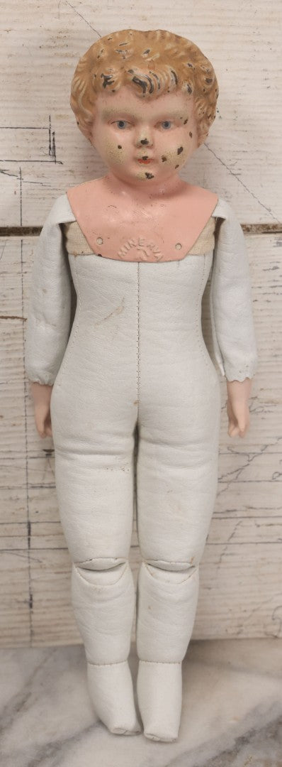 Lot 084 - Antique German Minerva Metal Head Doll With Molded Blonde Hair And Painted Features, Cloth And Leather Body, Circa 1900s-1920s 12" H