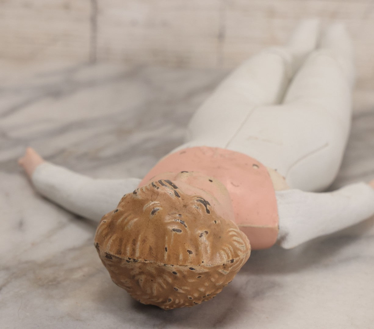 Lot 084 - Antique German Minerva Metal Head Doll With Molded Blonde Hair And Painted Features, Cloth And Leather Body, Circa 1900s-1920s 12" H