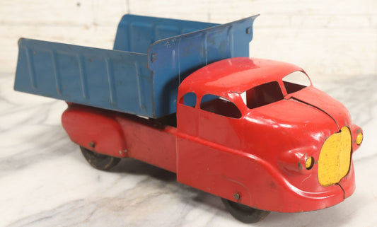 Lot 089 - Vintage Blue And Red Pressed Steel Dump Truck, Wyandotte Toys, Circa 1940s With Working Tilting Bed And Yellow Painted Grille, 13" L