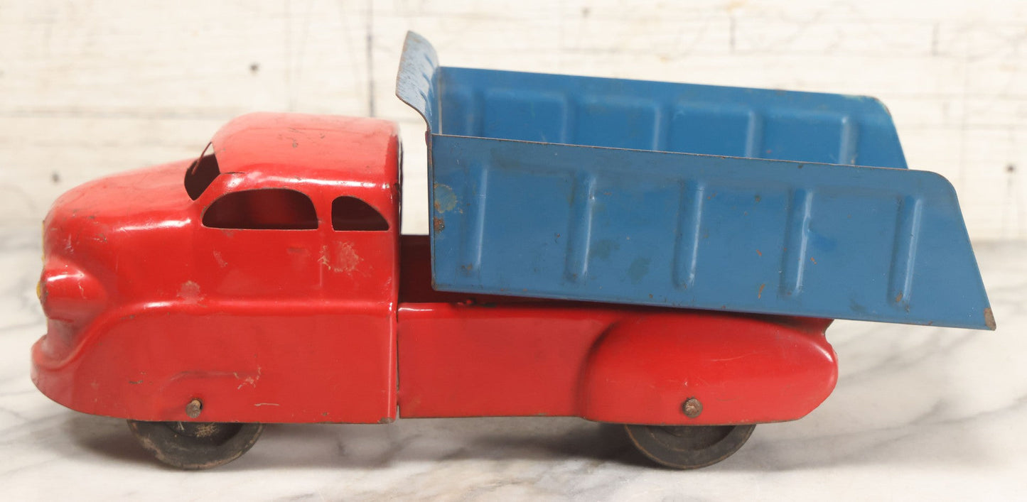 Lot 089 - Vintage Blue And Red Pressed Steel Dump Truck, Wyandotte Toys, Circa 1940s With Working Tilting Bed And Yellow Painted Grille, 13" L