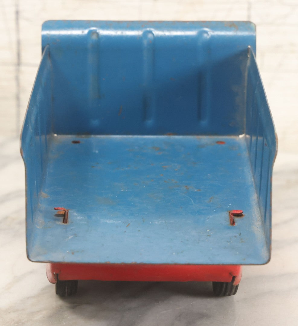 Lot 089 - Vintage Blue And Red Pressed Steel Dump Truck, Wyandotte Toys, Circa 1940s With Working Tilting Bed And Yellow Painted Grille, 13" L