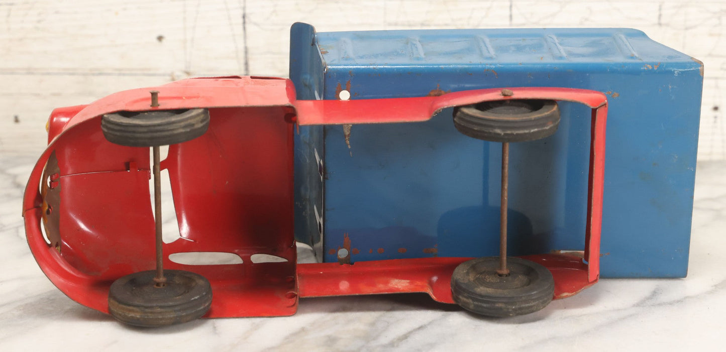 Lot 089 - Vintage Blue And Red Pressed Steel Dump Truck, Wyandotte Toys, Circa 1940s With Working Tilting Bed And Yellow Painted Grille, 13" L