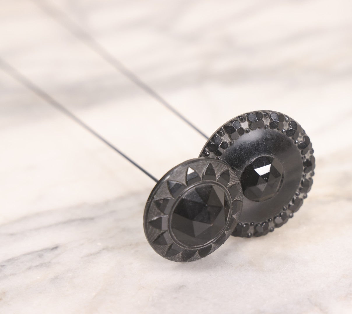 Lot 104 - Pair Of Antique Black Hat Pins With Decorative Tops, 10-1/2" L And 12-1/2" L