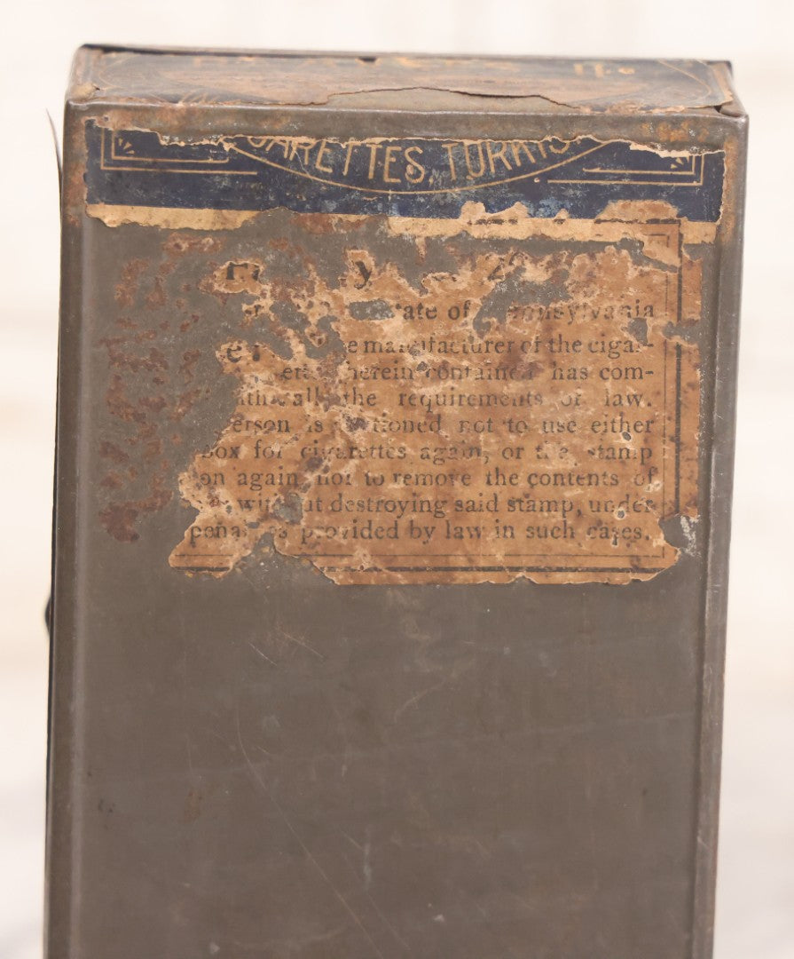 Lot 106 - Antique Stephano Brothers Paper Covered Egyptian Cigarette Tin For Ramses II Cigarettes, Manufactured From Yenidj Turkish Tobacco, Philadelphia, Pennsylvania