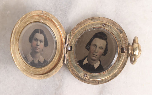 Lot 141 - Antique Gold Toned Locket With Tintype Photographs Of A Young Woman And Man Under Beveled Glass Circles