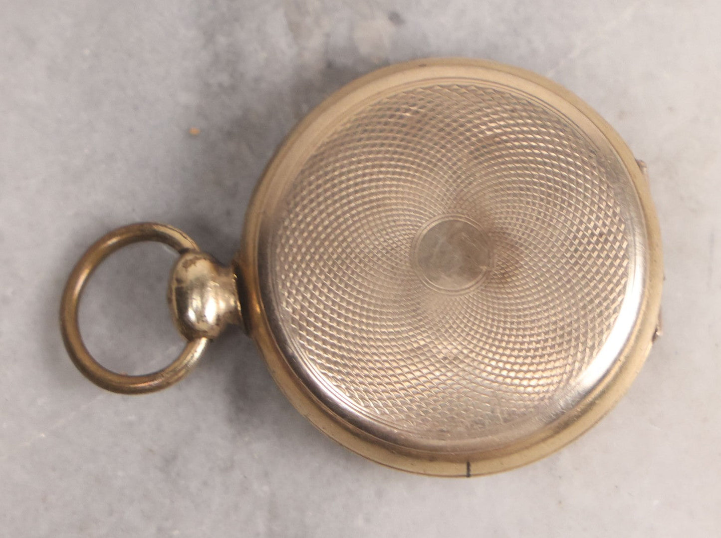 Lot 141 - Antique Gold Toned Locket With Tintype Photographs Of A Young Woman And Man Under Beveled Glass Circles