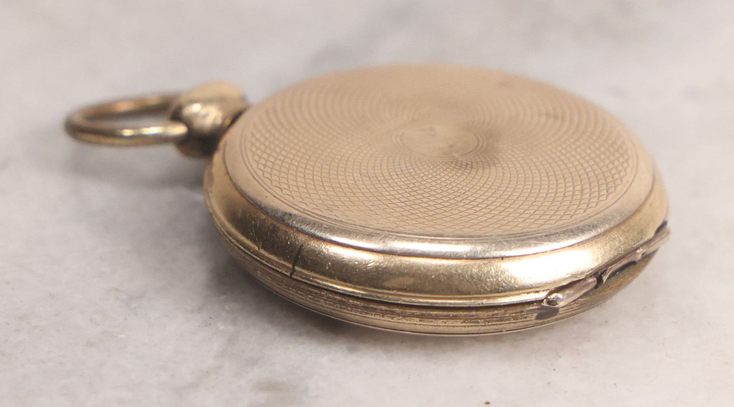 Lot 141 - Antique Gold Toned Locket With Tintype Photographs Of A Young Woman And Man Under Beveled Glass Circles