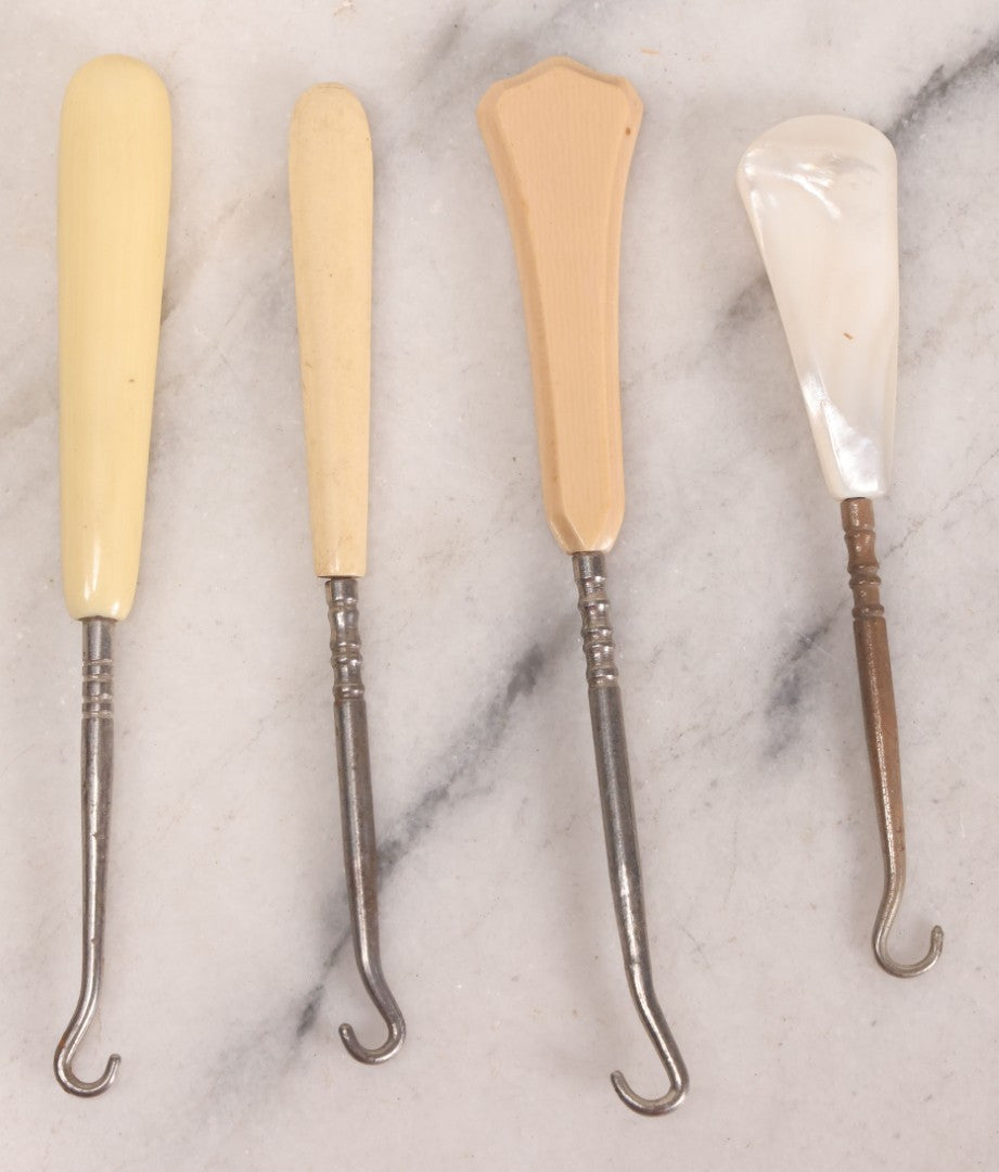 Lot 158 - Grouping Of 16 Antique And Vintage Buttonhooks In Various Materials Including Sterling Silver, Bone, Celluloid, And Mother-Of-Pearl