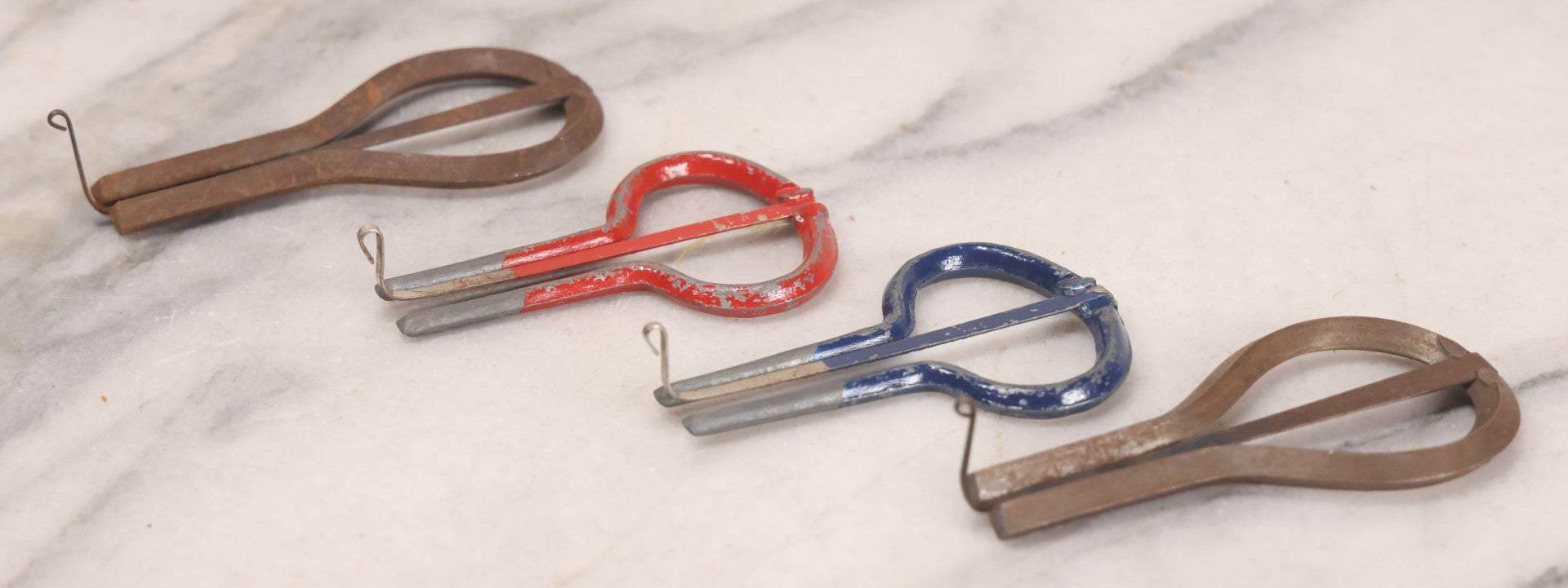 Lot 159 - Grouping Of Four Antique And Vintage Jaw Harps, Mouth Harps, Jew's Harps In Steel With Painted Enamel Finishes