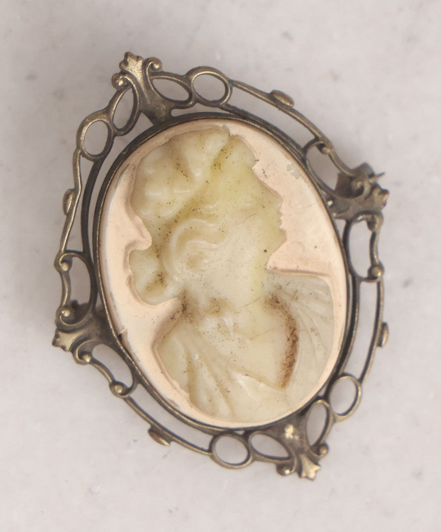 Lot 161 - Trio Of Miscellaneous Vintage Smalls Including Tony Amabile, Center Harbor, New Hampshire Metal Badge, Masonic Printing Block, Vintage Costume Jewelry Cameo Brooch